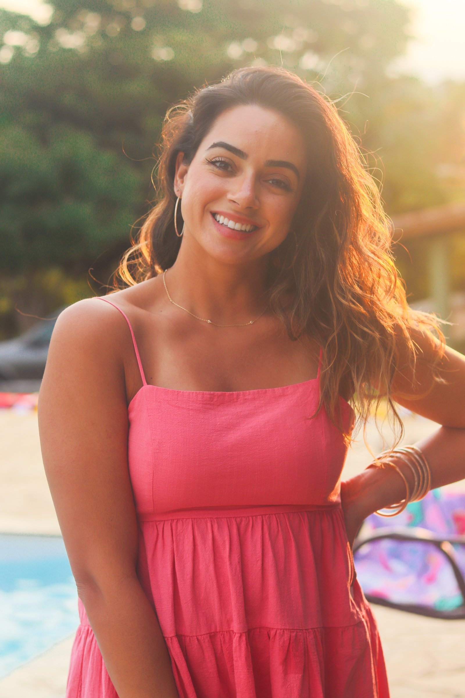 Andressa Opazo smiling outdoors at golden hour